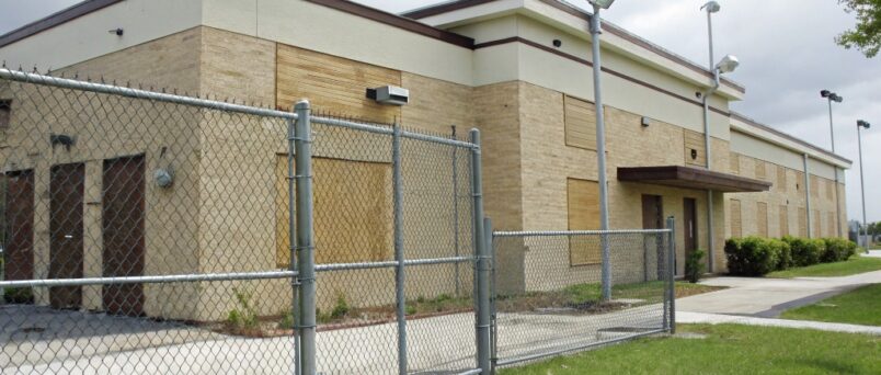 Use robust physical barriers, 24/7 remote monitoring, regular inspections, and smart lighting to prevent squatting and vandalism.